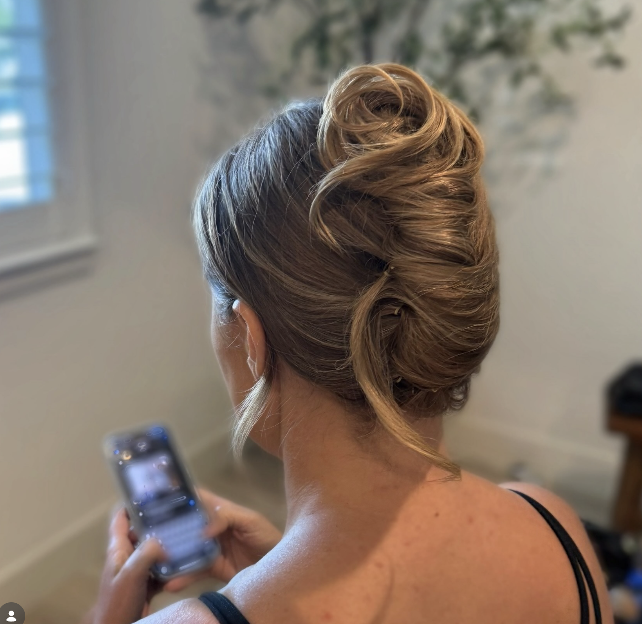 Back view of a softly twisted updo at The Studio Los Gatos