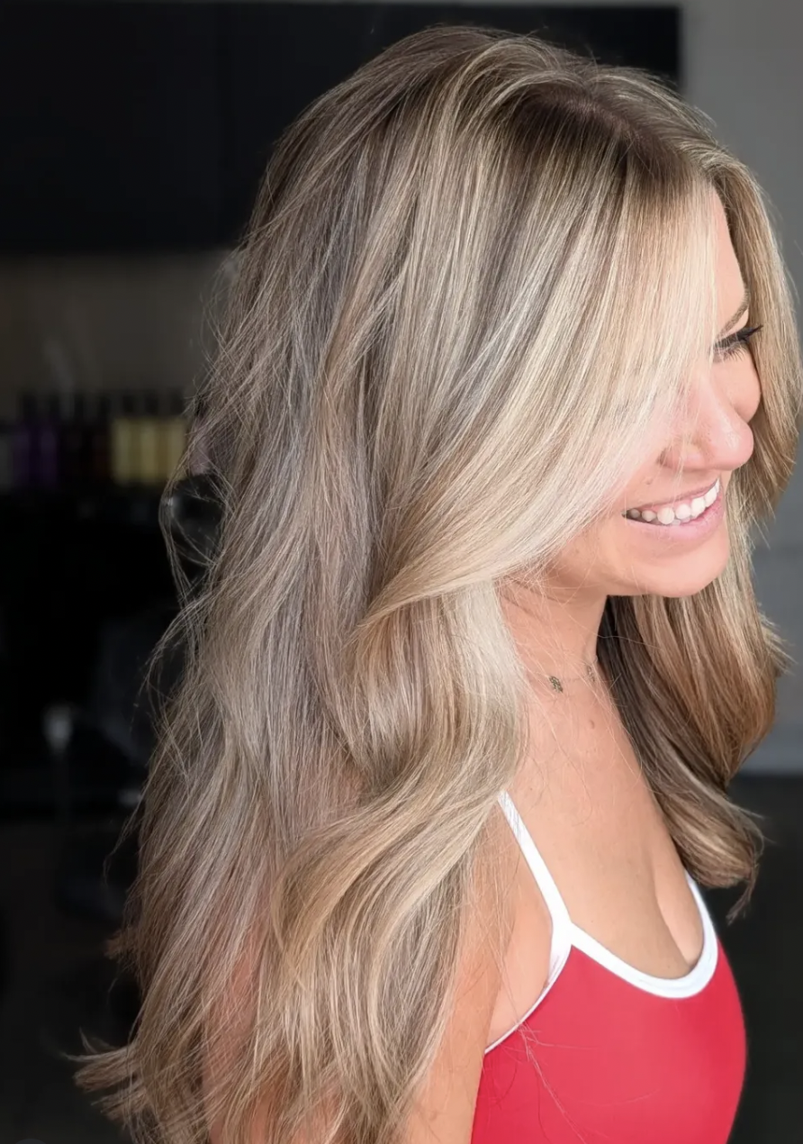 Side profile of softly waved platinum blonde hair