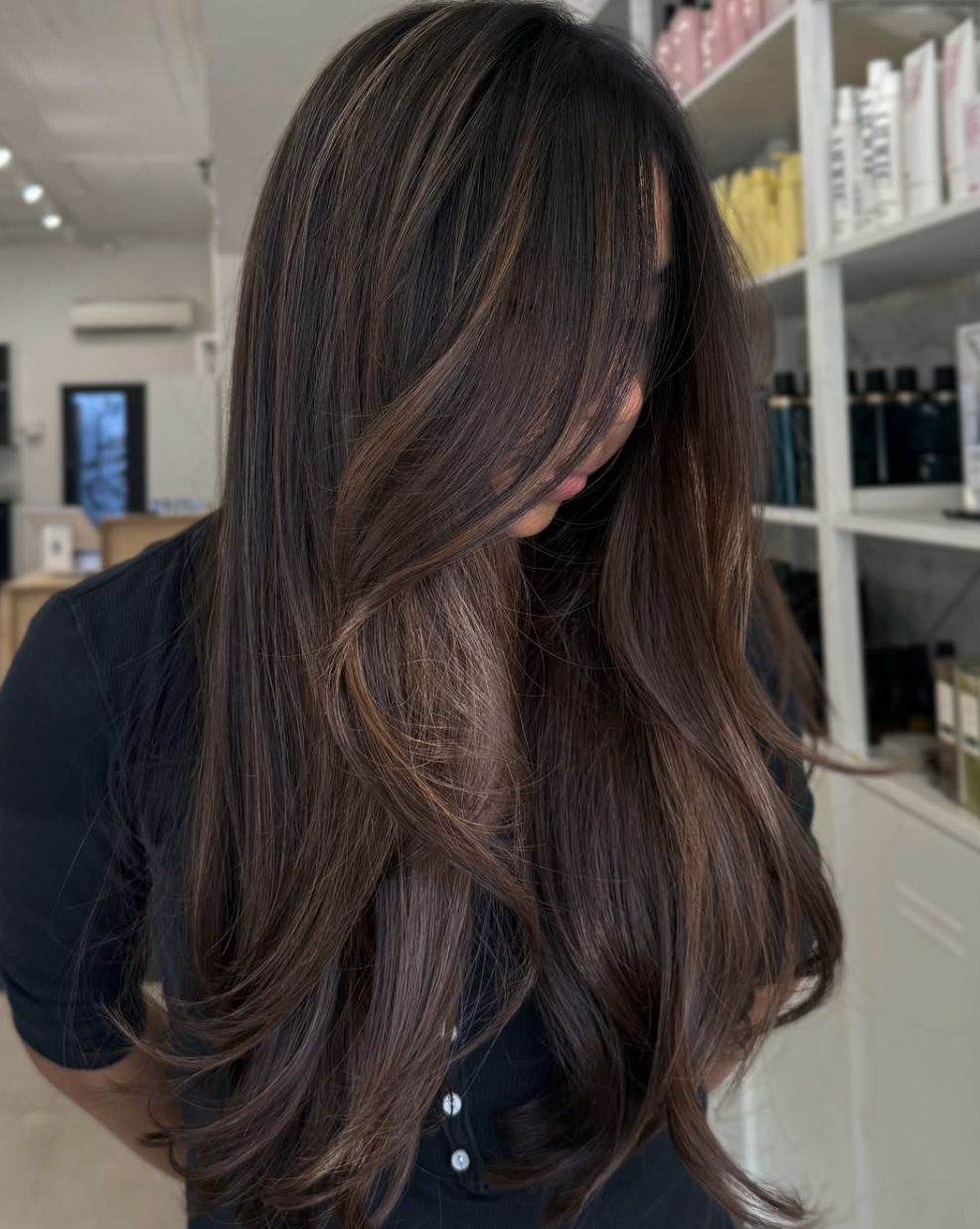 Long brunette layers with softly curved ends at The Studio Los Gatos