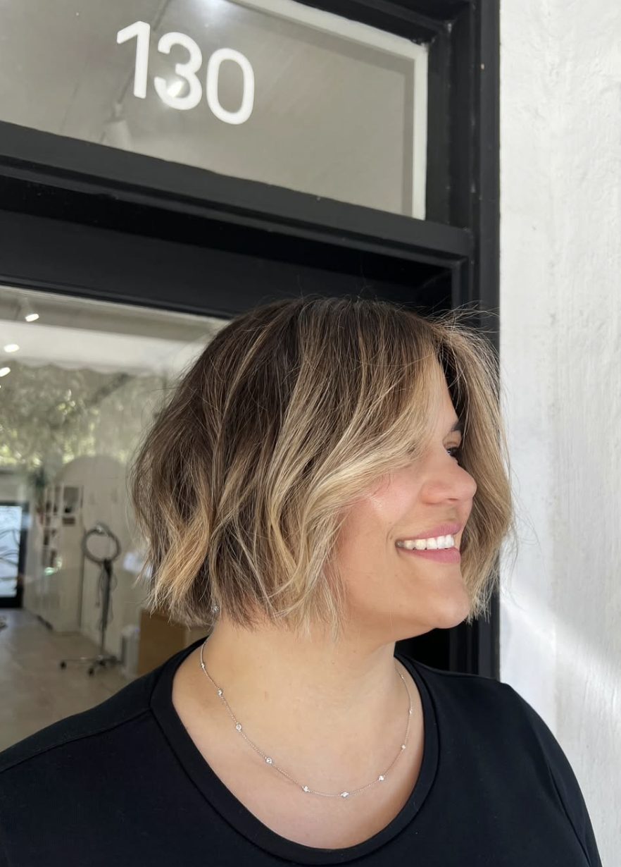 A textured bob with blonde ends outside The Studio Los Gatos